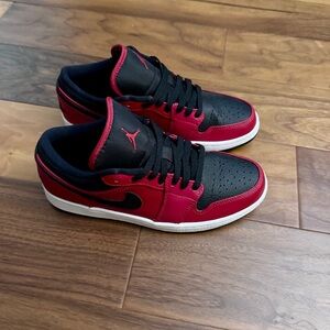 Men’s Air Jordan 1 Low
Reverse Bred Pebbled Swoosh Sneakers
